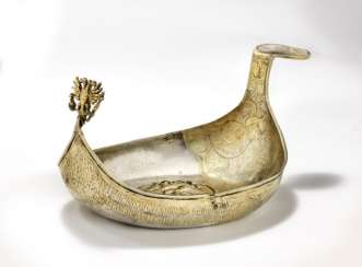 Moscow maker, late 17th century: A Russian Imperial parcel-gilt silver kovsh. Present from Peter I the Great and Ivan V to Grigory Shtchepetov 1693. L. 30 cm. Moscow maker, late 17th century: A Russian Imperial parcel-gilt silver kovsh. Present from Peter I the Great and Ivan V to Grigory Shtchepetov 1693. L. 30 cm.