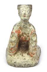 Painted clay Figurine of a kneeling man Painted clay Figurine of a kneeling man