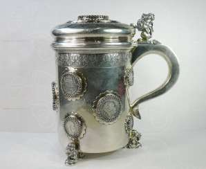 Mug of beer with coins Mug of beer with coins