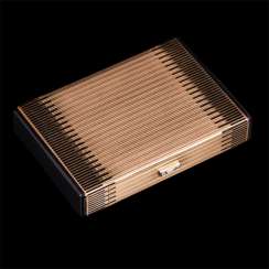 Elegant gold cosmetic bag with enamel and diamonds from Cartier Paris Elegant gold cosmetic bag with enamel and diamonds from Cartier Paris