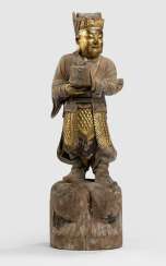 Wooden figure of a young man with traces of paint pad and gilding Wooden figure of a young man with traces of paint pad and gilding