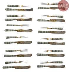 Exceptional set of twelve knives and twelve forks, the handles of jasper Revna, the steel blades engraved with the water high, gilded and blued, decorated on both sides with scenes of hunting and animals. Good condition, slight wear. Exceptional set of twelve knives and twelve forks, the handles of jasper Revna, the steel blades engraved with the water high, gilded and blued, decorated on both sides with scenes of hunting and animals. Good condition, slight wear.