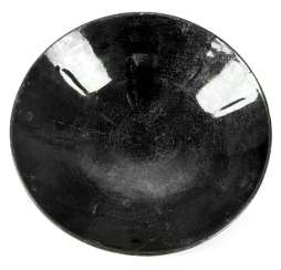 Shell with black, craquelierter luster glaze and a few bruises Shell with black, craquelierter luster glaze and a few bruises