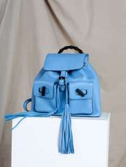 MARIAN KEYES'S LIGHT BLUE LEATHER BACKPACK WITH BAMBOO HANDLE AND TASSELS MARIAN KEYES'S LIGHT BLUE LEATHER BACKPACK WITH BAMBOO HANDLE AND TASSELS