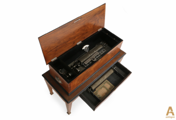 Large music box on a table with a cylindrical mechanism Large music box on a table with a cylindrical mechanism