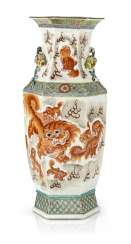 Hexagonal Vase with lion decoration and plastic pomegranates Hexagonal Vase with lion decoration and plastic pomegranates