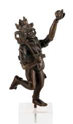 Bronze in a moving posture, probably Yami Bronze in a moving posture, probably Yami
