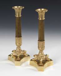 Pair of bronze candlesticks in the late Empire style Pair of bronze candlesticks in the late Empire style