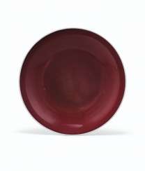 A COPPER-RED-GLAZED DISH A COPPER-RED-GLAZED DISH
