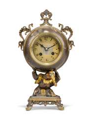 A FRENCH 'JAPONISME' PATINATED-BRONZE FIGURAL TABLE CLOCK A FRENCH 'JAPONISME' PATINATED-BRONZE FIGURAL TABLE CLOCK