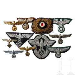 A Small Collection of Cap and Sleeve Insignia A Small Collection of Cap and Sleeve Insignia